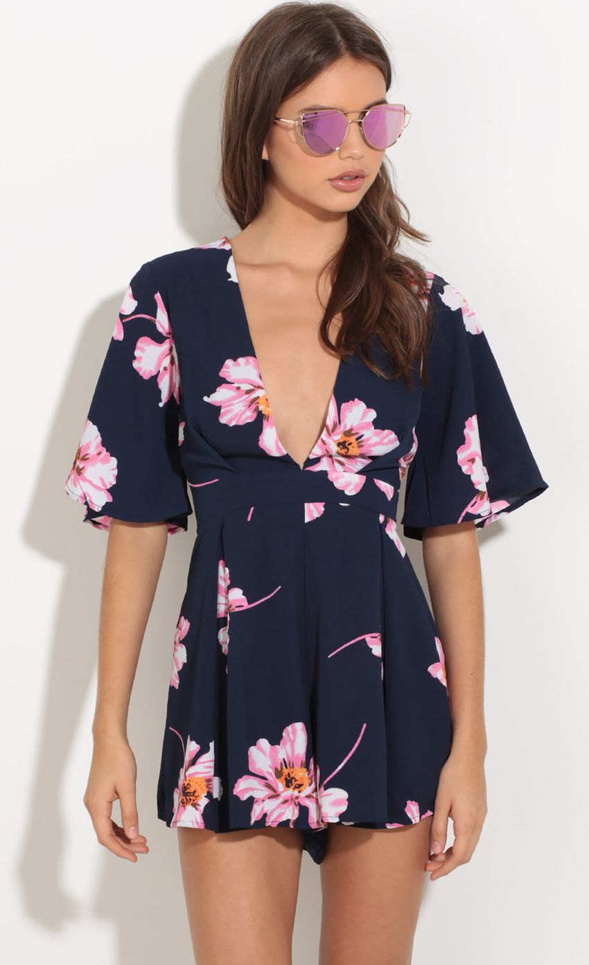 Picture Plunge Pleated Floral Print Romper In Navy. Source: https://media-img.lucyinthesky.com/data/Oct16_2/850xAUTO/0Y5A7804.JPG