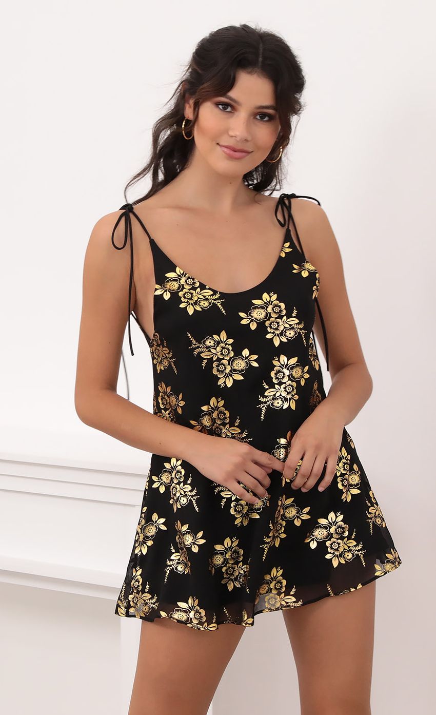 Picture Kiara Gold Floral Chiffon Tie Dress in Black. Source: https://media-img.lucyinthesky.com/data/Oct20_1/850xAUTO/1V9A6127.JPG