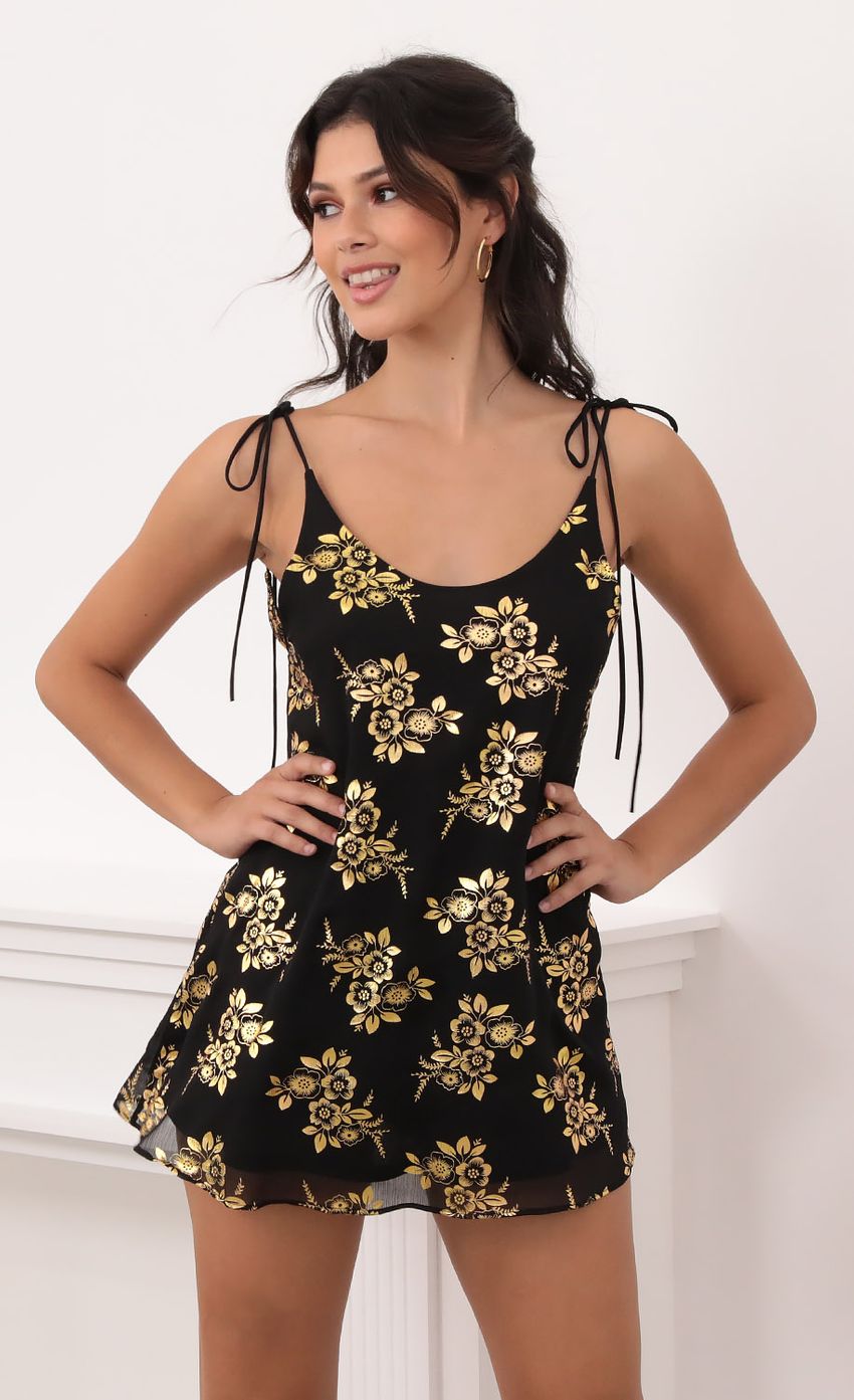 Picture Kiara Gold Floral Chiffon Tie Dress in Black. Source: https://media-img.lucyinthesky.com/data/Oct20_1/850xAUTO/1V9A6130.JPG