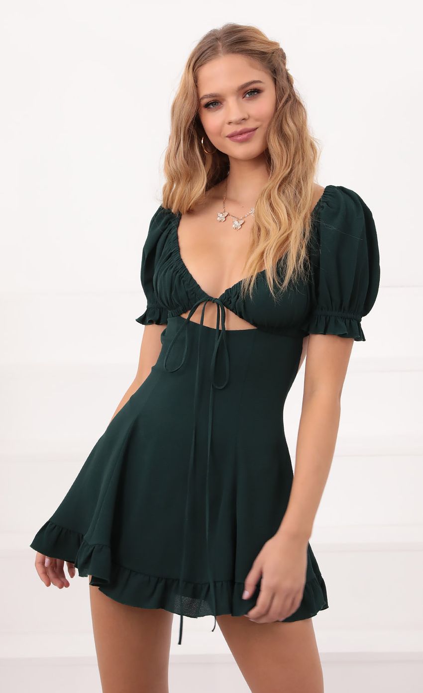 Picture Isela Puff Sleeve Dress in Hunter Green. Source: https://media-img.lucyinthesky.com/data/Oct20_1/850xAUTO/781A6323.JPG