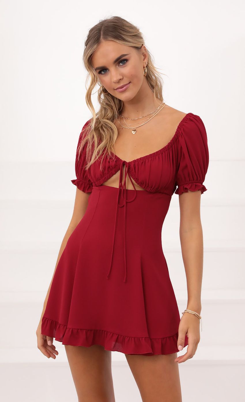 Picture Isela Puff Sleeve Dress in Burgundy. Source: https://media-img.lucyinthesky.com/data/Oct20_2/850xAUTO/1V9A5915.JPG