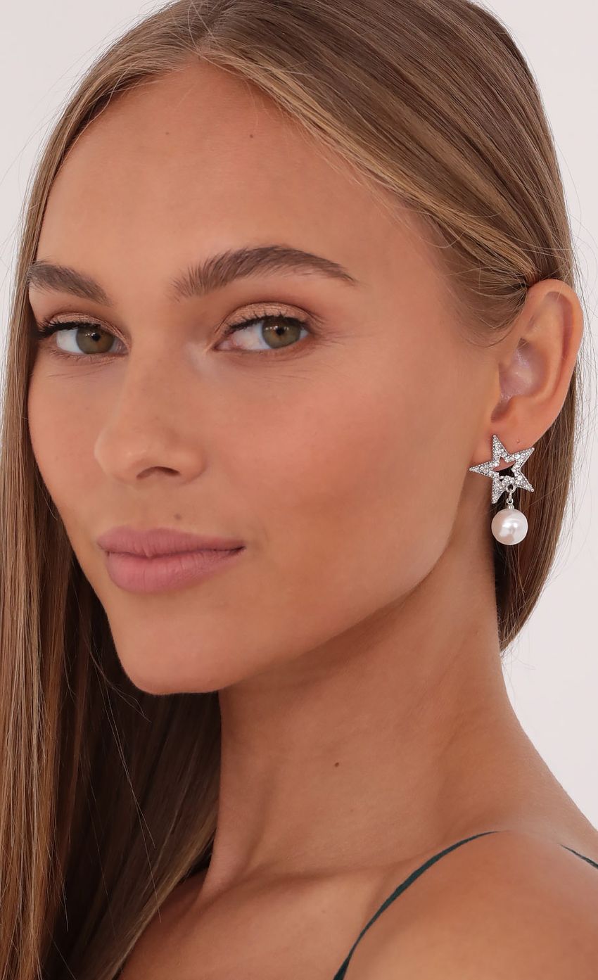 Picture Star Studded Pearl Earrings in Silver. Source: https://media-img.lucyinthesky.com/data/Oct21_1/850xAUTO/1V9A0129.JPG