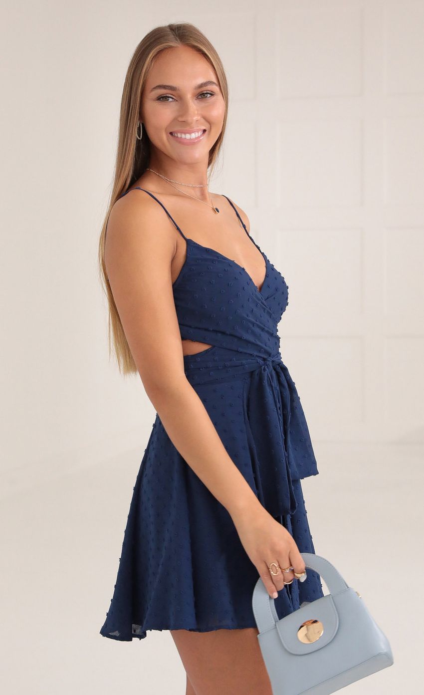 Picture Chiffon Wrap Dress in Navy Blue. Source: https://media-img.lucyinthesky.com/data/Oct21_1/850xAUTO/1V9A0391.JPG