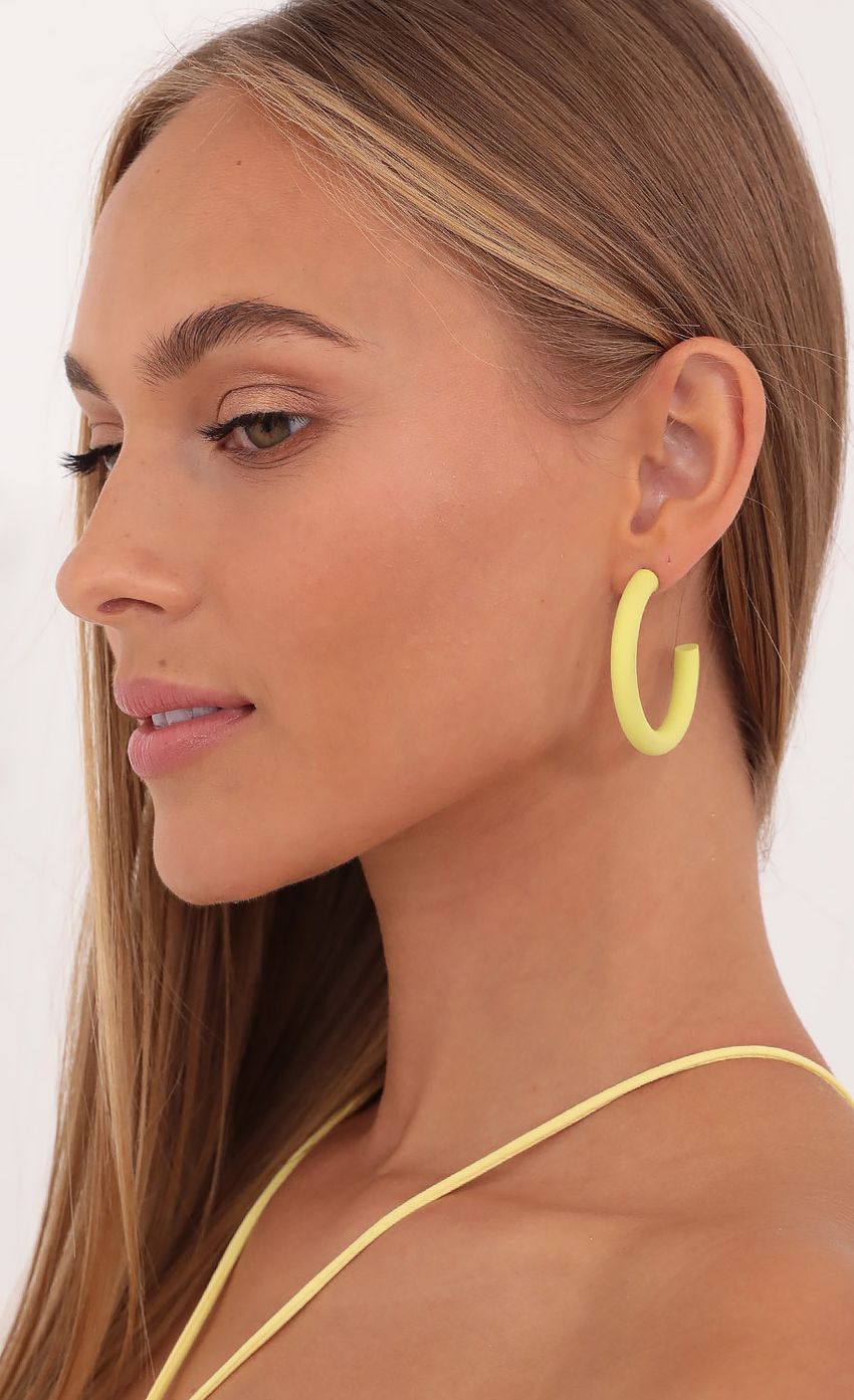 Picture Highlight of My Life Hoop Earrings in Yellow. Source: https://media-img.lucyinthesky.com/data/Oct21_1/850xAUTO/1V9A2882.JPG