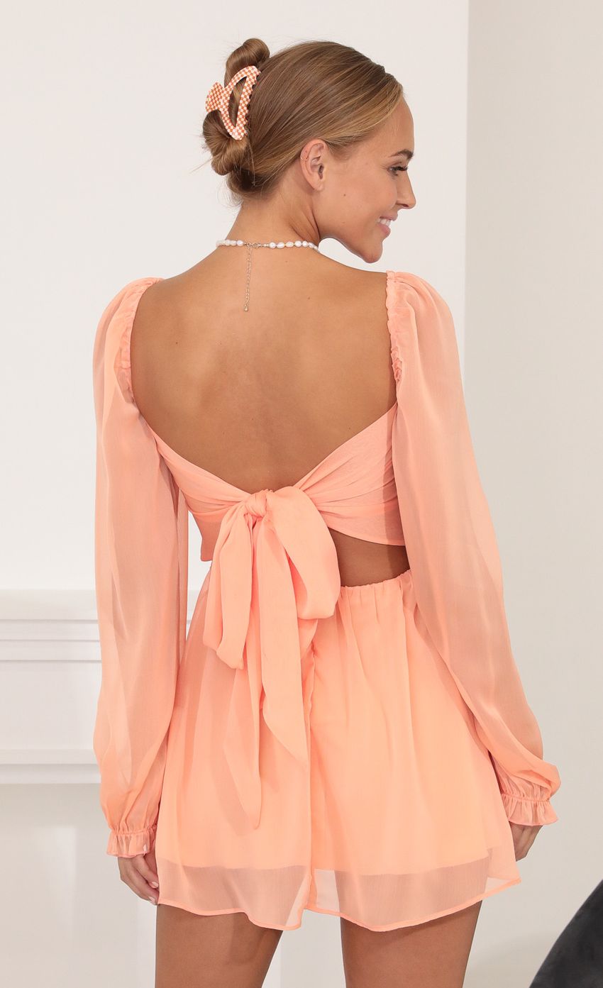 Picture Fit and Flare Dress in Peach. Source: https://media-img.lucyinthesky.com/data/Oct21_1/850xAUTO/1V9A2907.JPG