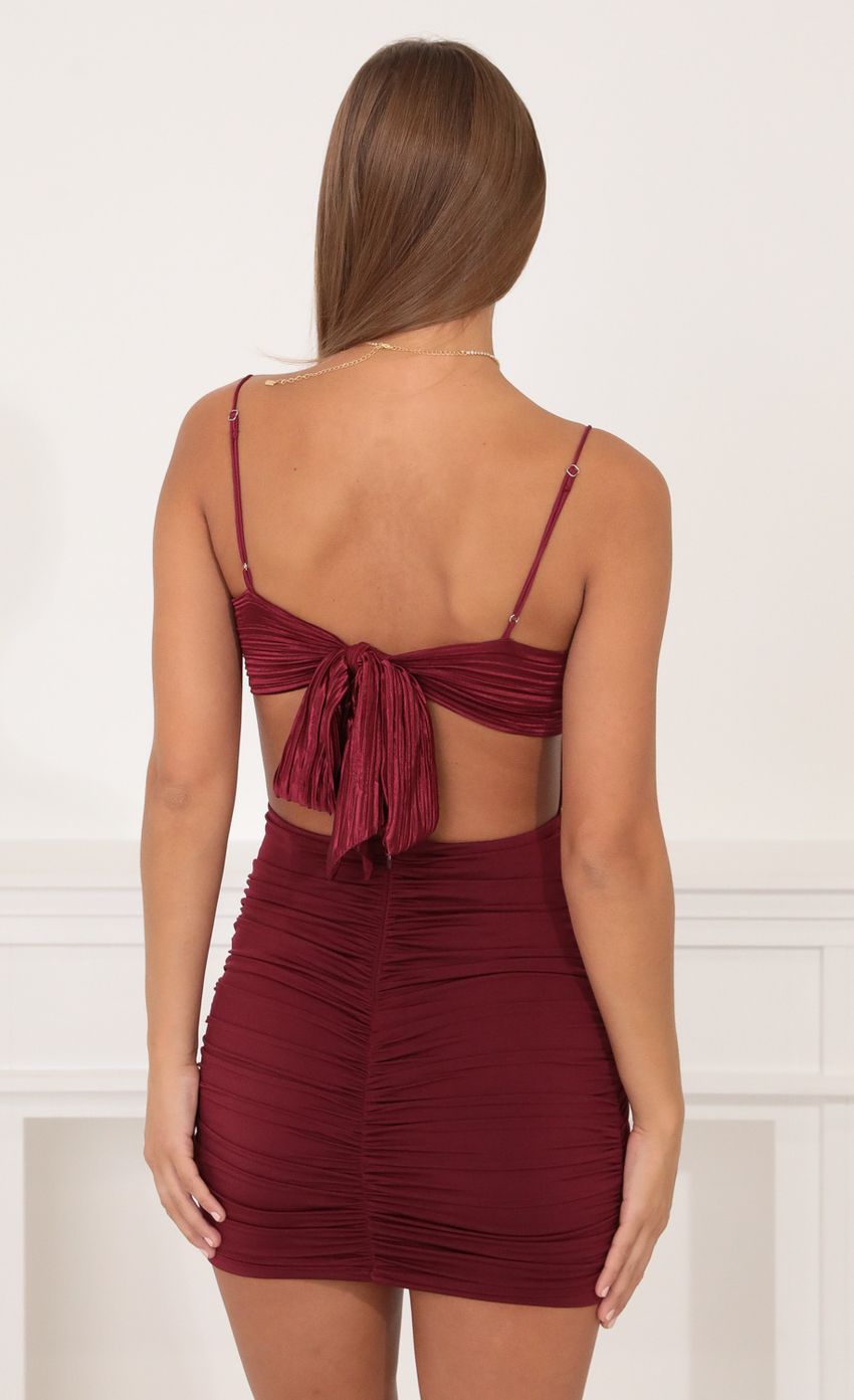 Picture Bodycon Ruched Dress in Burgundy. Source: https://media-img.lucyinthesky.com/data/Oct21_1/850xAUTO/1V9A9468.JPG