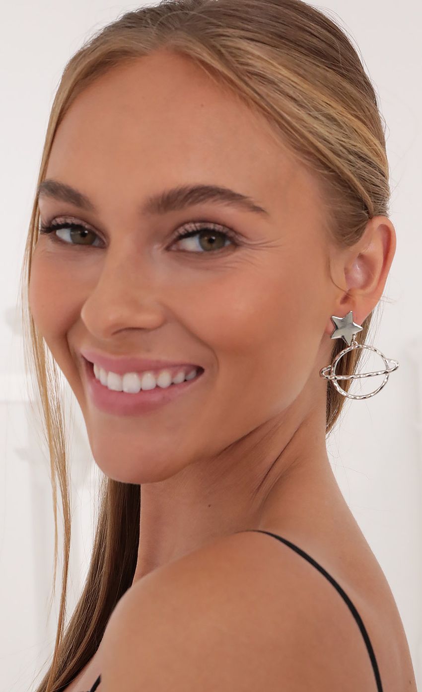 Picture Take Me To Saturn Earrings in Silver. Source: https://media-img.lucyinthesky.com/data/Oct21_2/850xAUTO/1V9A0127.JPG
