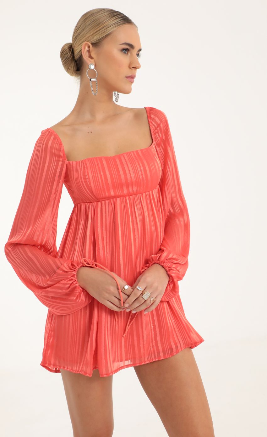 Picture Shayla Striped Long Sleeve Baby Doll Dress in Coral. Source: https://media-img.lucyinthesky.com/data/Oct22/850xAUTO/04ac3689-ac72-4b65-b019-f6f399b65345.jpg
