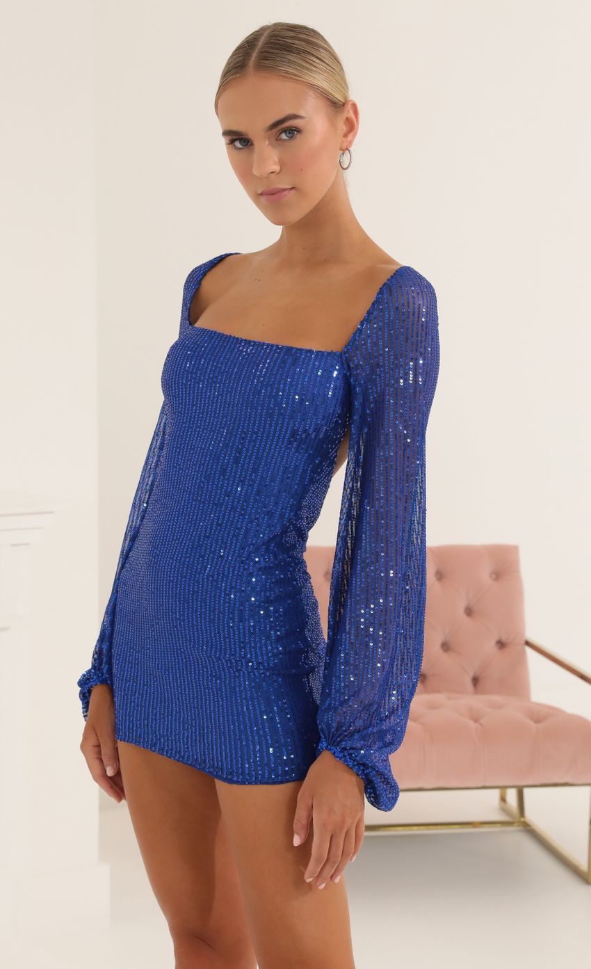 Picture Sequin Open Back Long Sleeve Dress in Blue. Source: https://media-img.lucyinthesky.com/data/Oct22/850xAUTO/0bfb8b78-80c2-4b8d-83ca-ff1863ce64f6.jpg
