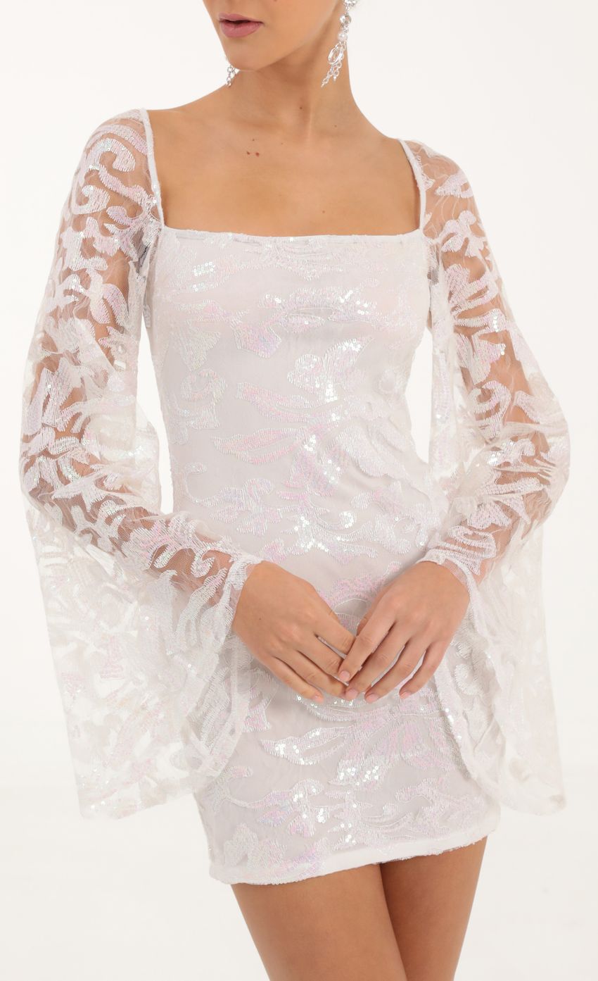 Picture Tulle Iridescent Sequin Flare Sleeve Dress in White. Source: https://media-img.lucyinthesky.com/data/Oct22/850xAUTO/1340c5d0-6994-4543-ae4d-c4ff9d6ff8c9.jpg