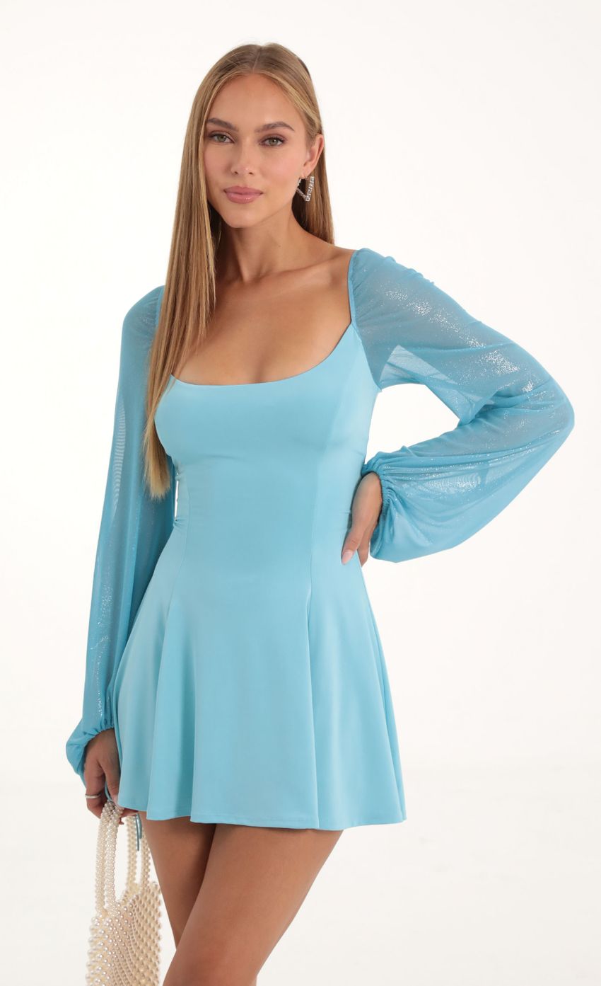 Picture Glitter Mesh Puff Sleeve Dress in Blue. Source: https://media-img.lucyinthesky.com/data/Oct22/850xAUTO/14f6599f-05ce-43de-b8b1-aa98e09f8244.jpg