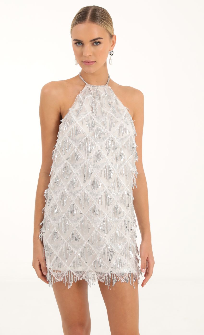 Picture Fringe Sequin Halter Dress in White. Source: https://media-img.lucyinthesky.com/data/Oct22/850xAUTO/59ea3896-661a-41fd-8337-203e6413659f.jpg