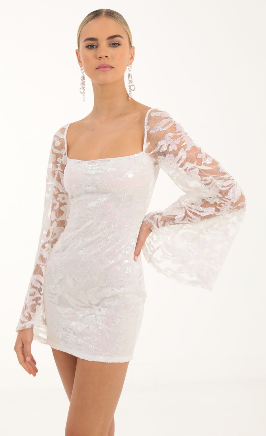 Picture Tulle Iridescent Sequin Flare Sleeve Dress in White. Source: https://media-img.lucyinthesky.com/data/Oct22/850xAUTO/62ece87a-4807-4c47-a9e9-4f9069ee0209.jpg