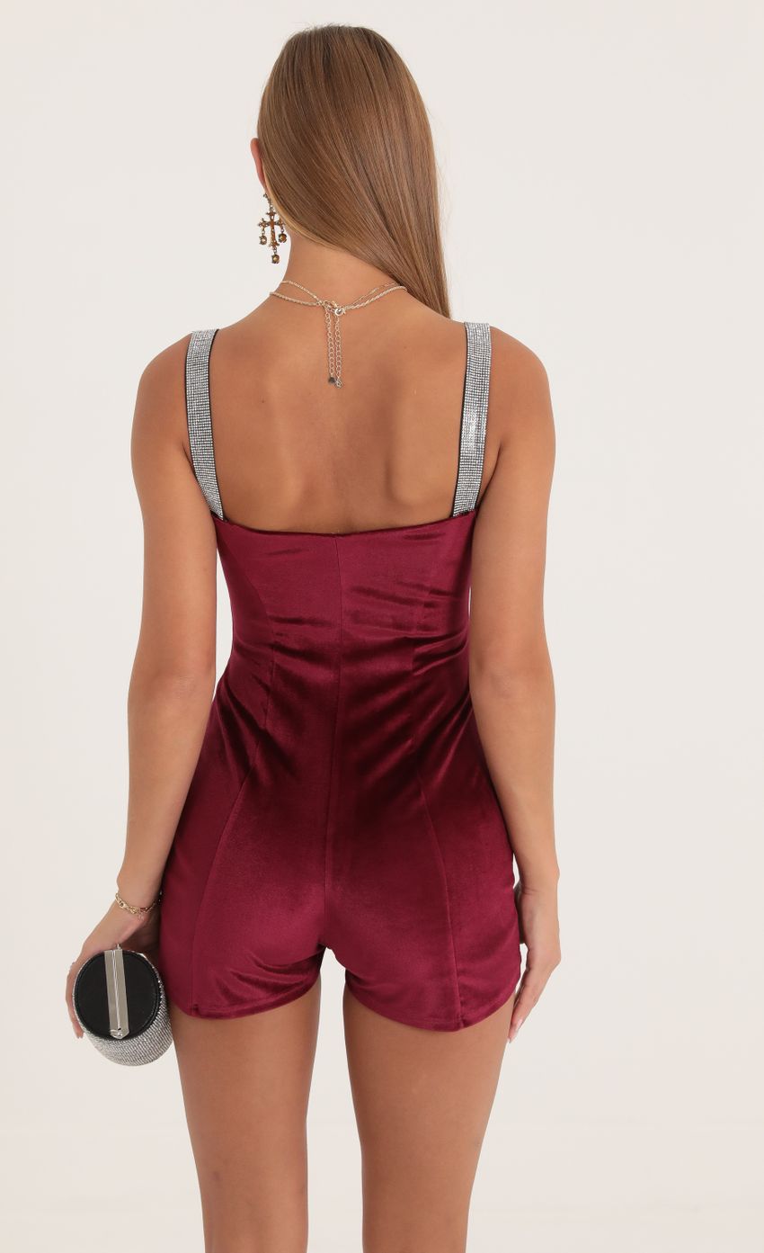 Picture Velvet Hook and Eye Romper in Red. Source: https://media-img.lucyinthesky.com/data/Oct22/850xAUTO/6552ae35-991b-4fdd-a16a-327def32c58a.jpg