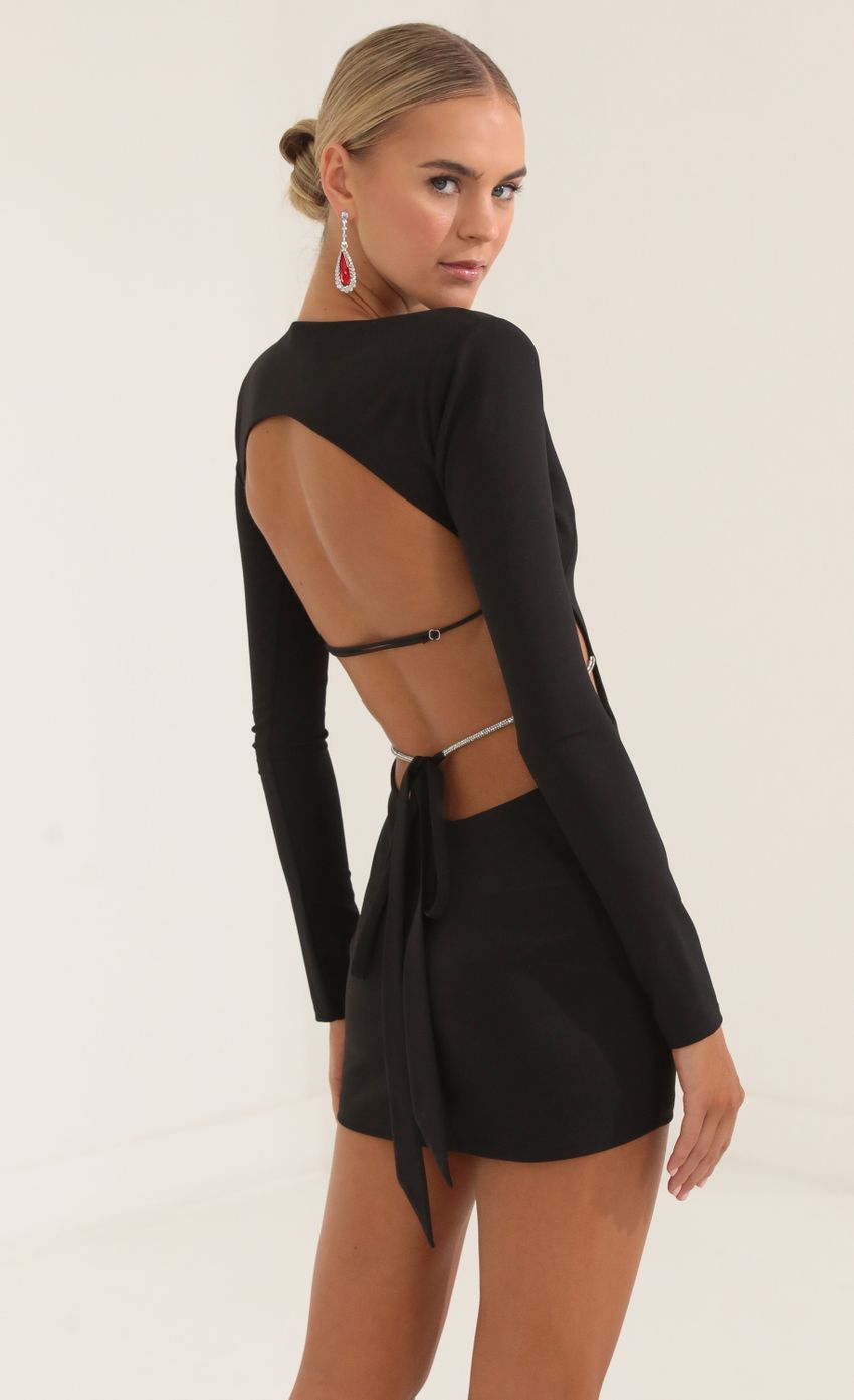 Picture Crepe Shoulder Pad Cutout Dress in Black. Source: https://media-img.lucyinthesky.com/data/Oct22/850xAUTO/6c057de2-7da5-424b-8ed2-eebb0b59607d.jpg
