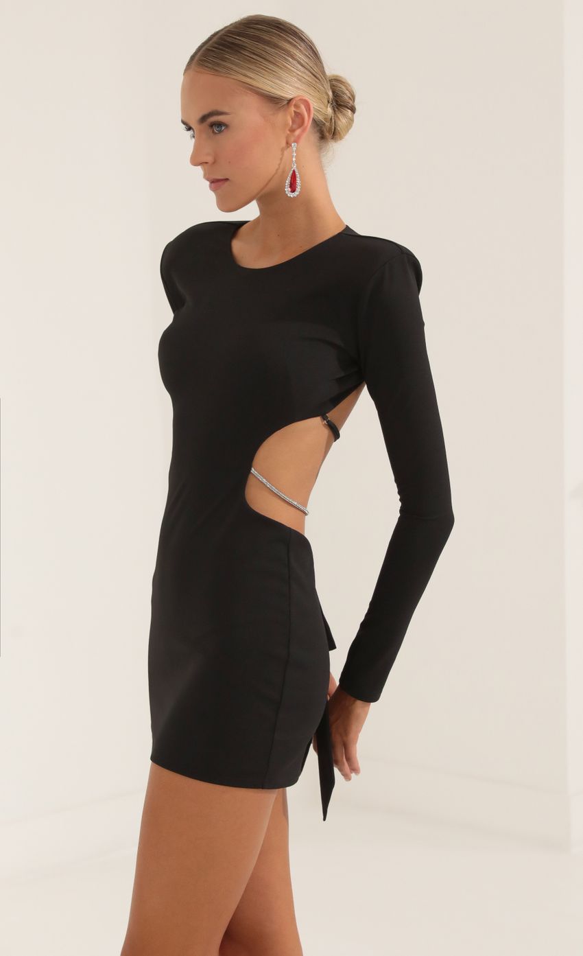Picture Crepe Shoulder Pad Cutout Dress in Black. Source: https://media-img.lucyinthesky.com/data/Oct22/850xAUTO/85cfc180-2c87-4cc6-8820-270396037cd2.jpg