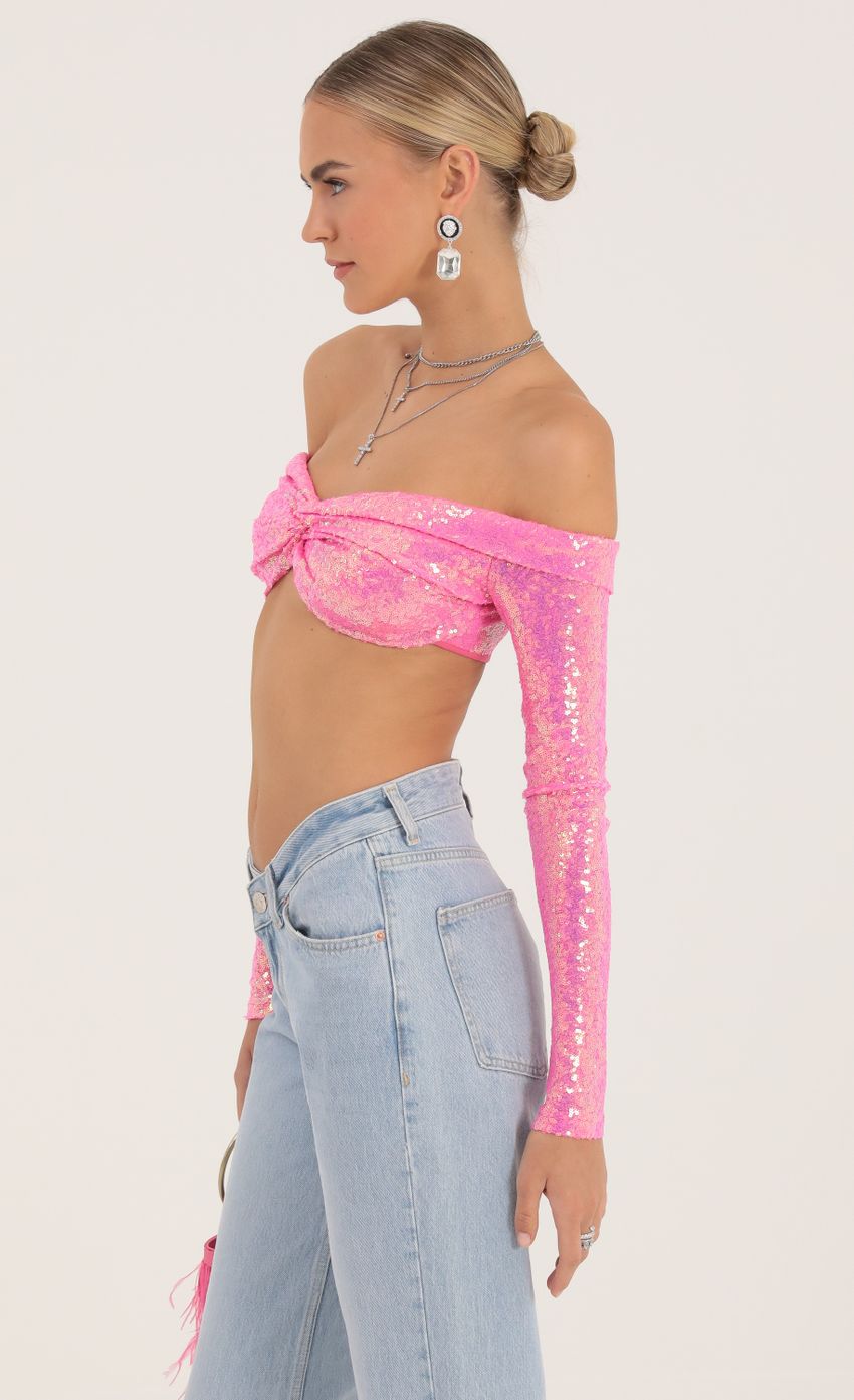 Picture Iridescent Sequin Off The Shoulder Top in Pink. Source: https://media-img.lucyinthesky.com/data/Oct22/850xAUTO/b67b11ab-a69c-458f-b920-6e67696dd64e.jpg