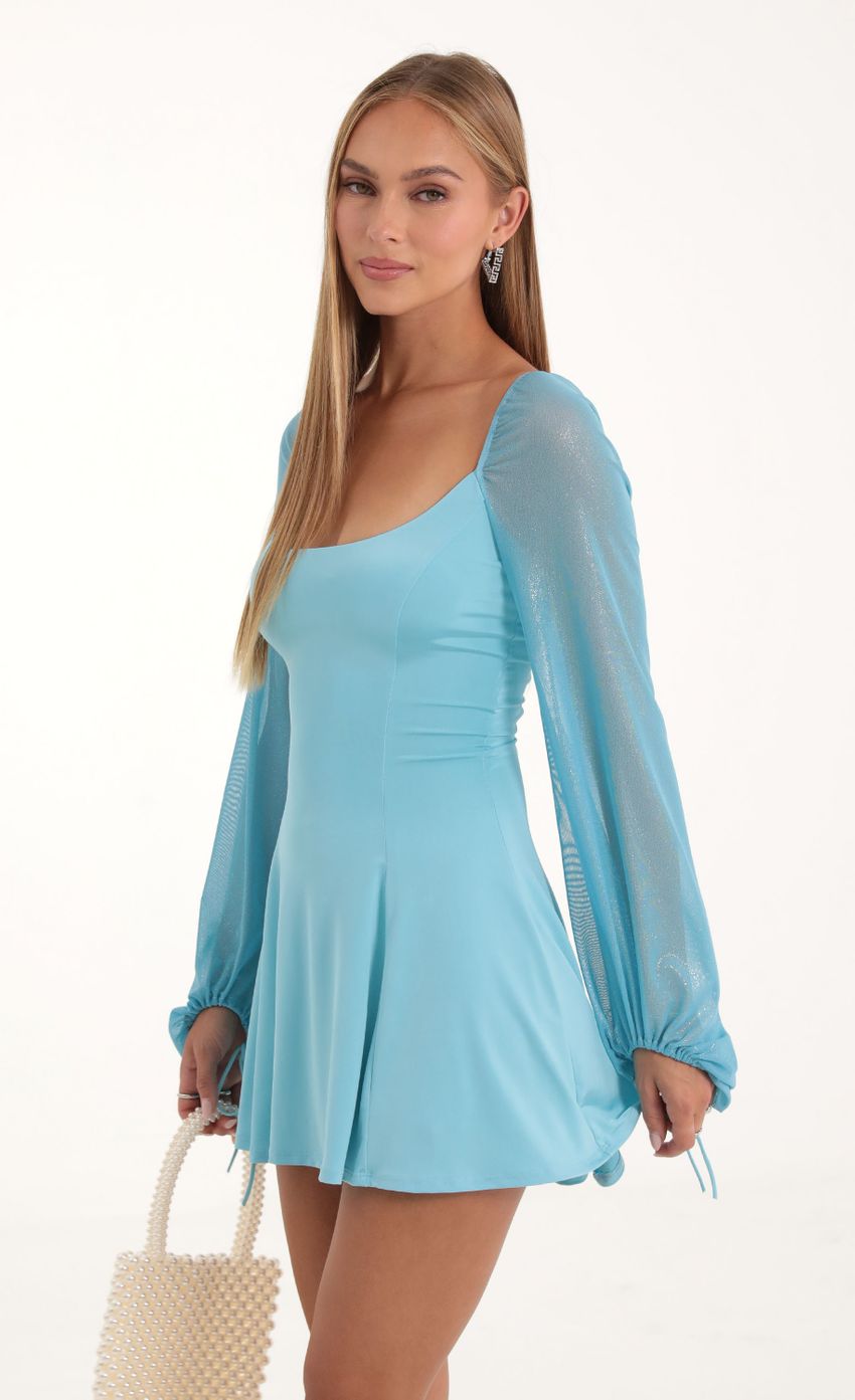 Picture Glitter Mesh Puff Sleeve Dress in Blue. Source: https://media-img.lucyinthesky.com/data/Oct22/850xAUTO/ceb05311-dc34-4214-aa1e-1ebe059f0f52.jpg