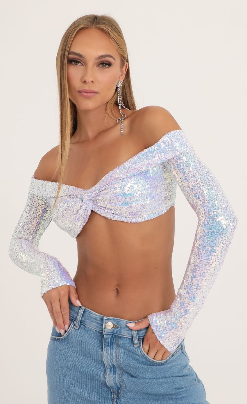 Picture Iridescent Sequin Off The Shoulder Top in Purple. Source: https://media-img.lucyinthesky.com/data/Oct22/850xAUTO/d3981216-c19f-4ca2-b4d5-c5a6b23a81e4.jpg