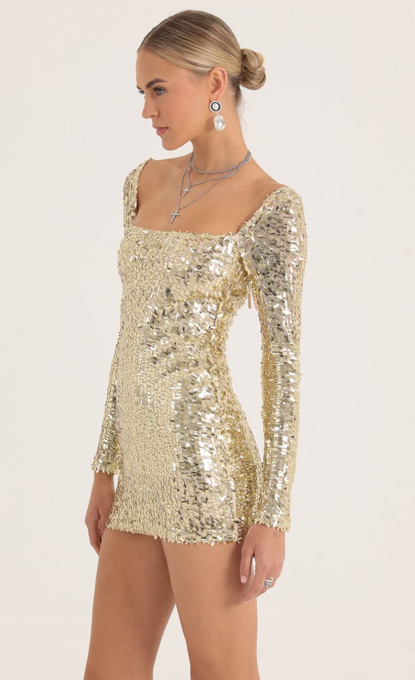 Picture Sequin Mesh Dress in Gold. Source: https://media-img.lucyinthesky.com/data/Oct22/850xAUTO/d9841231-6850-4368-a84b-3afa5f7140a2.jpg