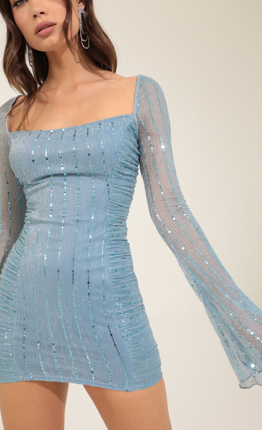Picture Metallic Sequin Ruched Bodycon Dress in Blue. Source: https://media-img.lucyinthesky.com/data/Oct22/850xAUTO/e5d97d24-9c5a-4118-bbbd-fbe71bb75a40.jpg