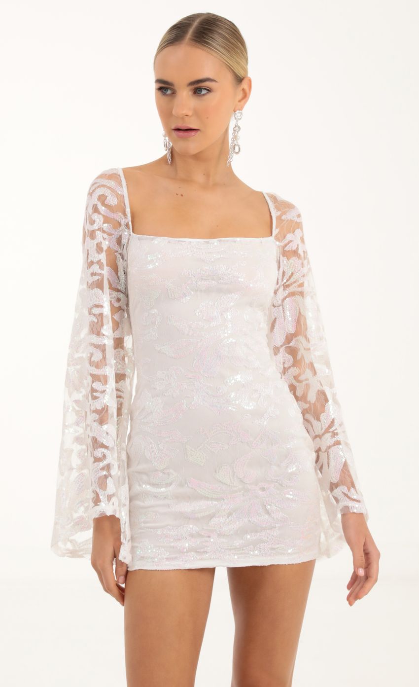 Picture Tulle Iridescent Sequin Flare Sleeve Dress in White. Source: https://media-img.lucyinthesky.com/data/Oct22/850xAUTO/f0a89b09-d096-4f90-a47b-c58b5c5d0330.jpg