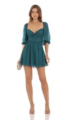 Picture Shimmer Chiffon Twist Dress in Teal. Source: https://media-img.lucyinthesky.com/data/Oct23/150xAUTO/cd1e2765-1387-4c0c-823c-f2d86474270c.jpg