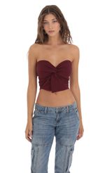 Picture Strapless Twist Top in Burgundy. Source: https://media-img.lucyinthesky.com/data/Oct23/150xAUTO/db597f96-cdaf-4b4d-b42d-f9e2a50cdc4a.jpg
