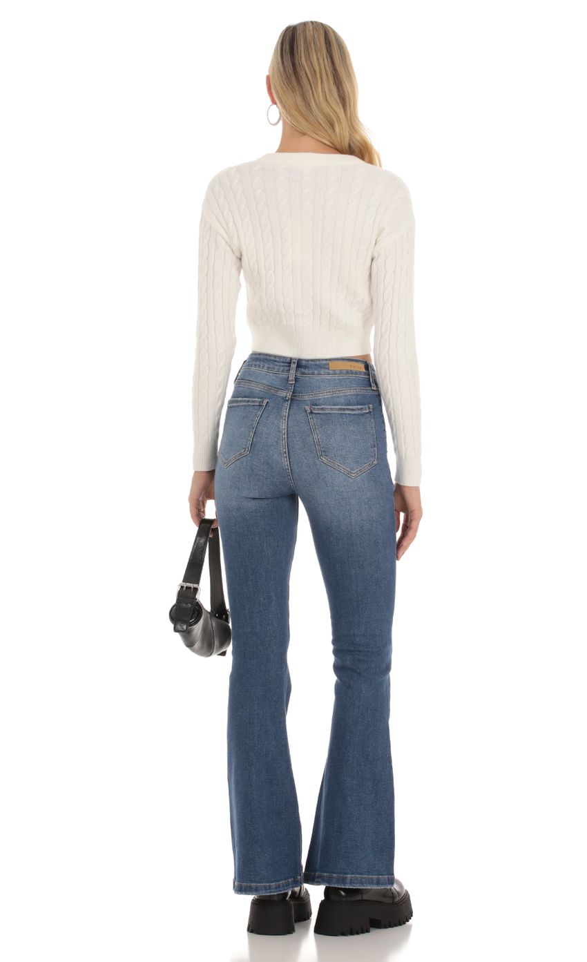 Picture Faded Flare Jeans in Denim. Source: https://media-img.lucyinthesky.com/data/Oct23/850xAUTO/030de922-dfb9-4c01-878e-66cb4fb61b40.jpg