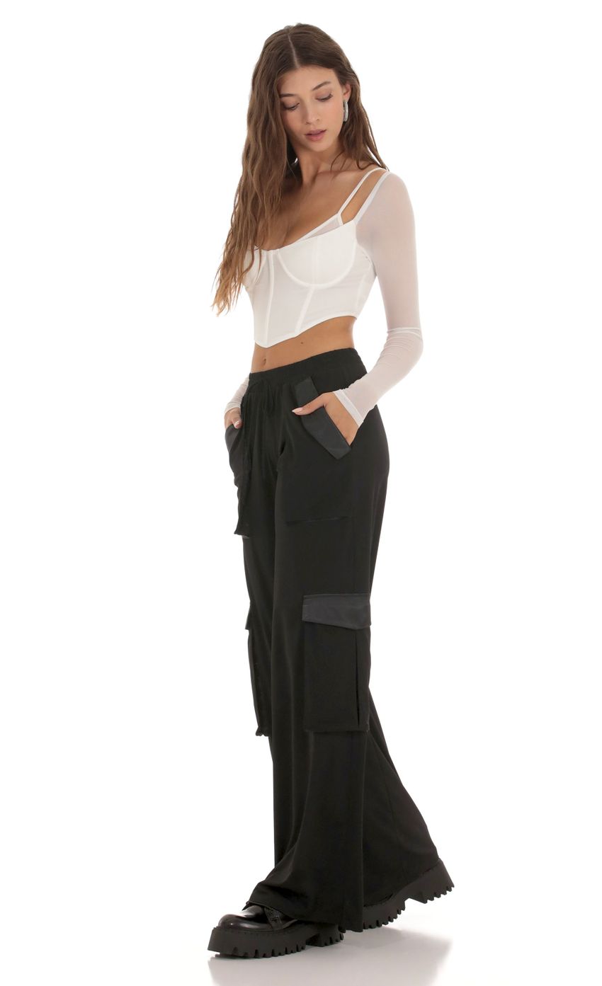 Picture Relaxed Cargo Pants in Black. Source: https://media-img.lucyinthesky.com/data/Oct23/850xAUTO/19c4199f-9426-42a8-89be-d12c3fd8ecd4.jpg