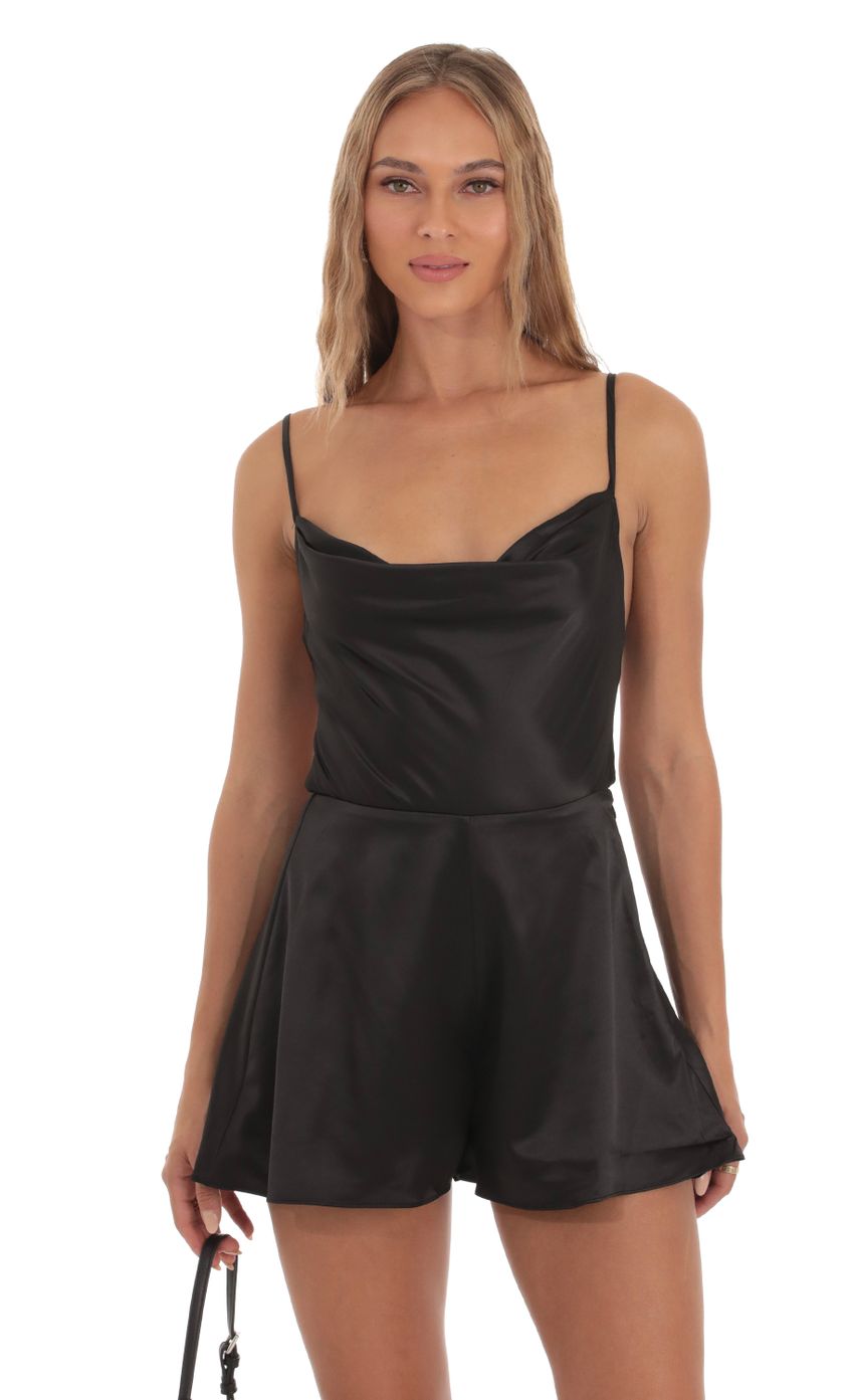 Picture Satin Cowl Neck Romper in Black. Source: https://media-img.lucyinthesky.com/data/Oct23/850xAUTO/26ea5aa6-0a9d-4cce-94a6-96f5c2aaa7db.jpg