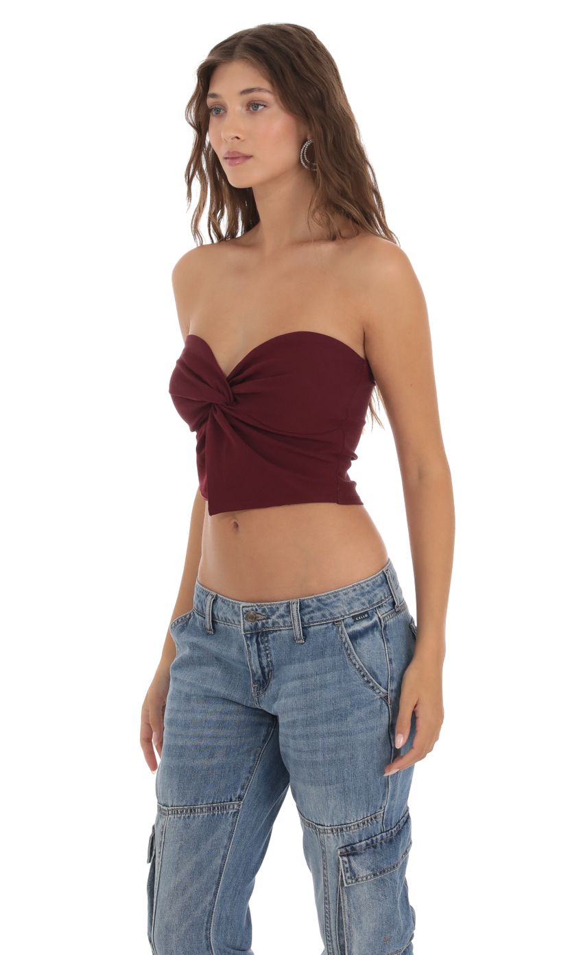 Picture Strapless Twist Top in Burgundy. Source: https://media-img.lucyinthesky.com/data/Oct23/850xAUTO/3c3a3ead-be73-445e-a6d8-1eefe1d2e56c.jpg