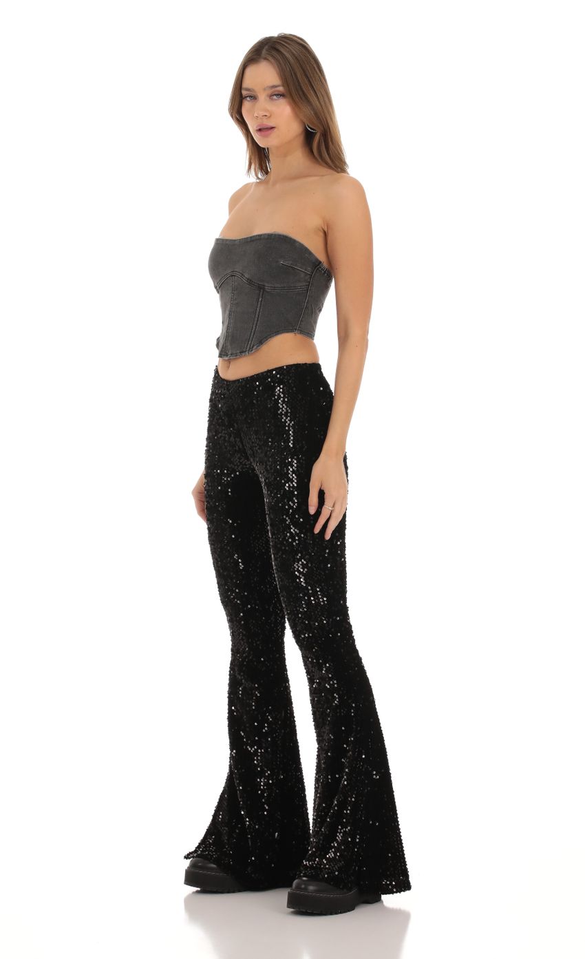 Picture Velvet Sequin Pants in Black. Source: https://media-img.lucyinthesky.com/data/Oct23/850xAUTO/593dd7c5-360f-46c7-b77d-7220ae4b5acc.jpg