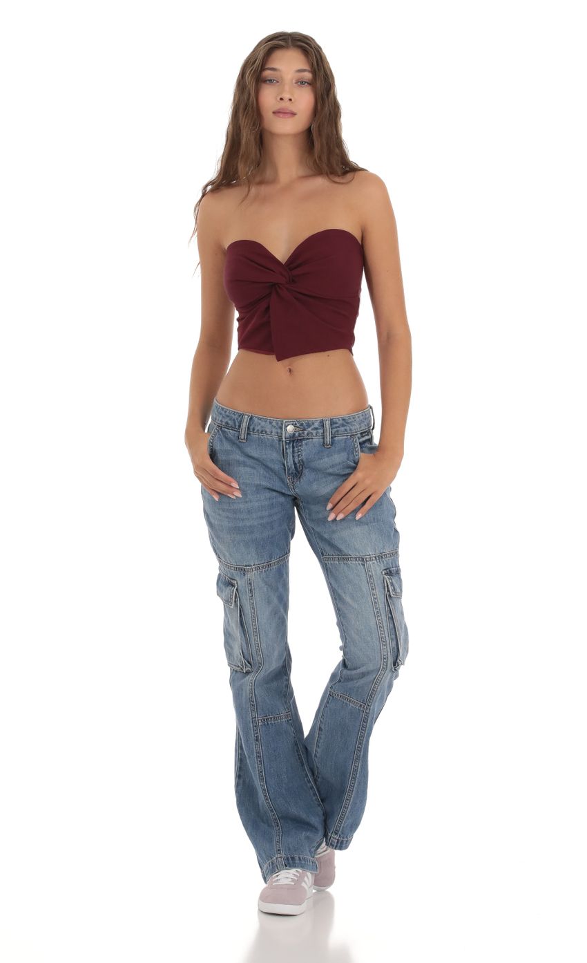 Picture Strapless Twist Top in Burgundy. Source: https://media-img.lucyinthesky.com/data/Oct23/850xAUTO/68110afa-be59-40ac-bce4-6494e243d33c.jpg