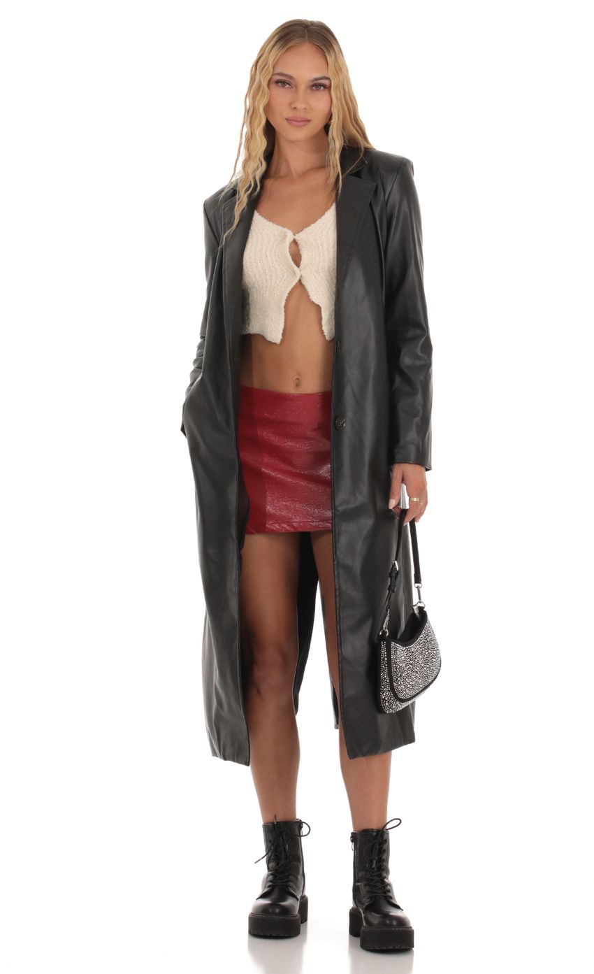 Picture Trench Coat in Black. Source: https://media-img.lucyinthesky.com/data/Oct23/850xAUTO/91ff7f69-2b92-41ef-8734-e2e66feb7056.jpg
