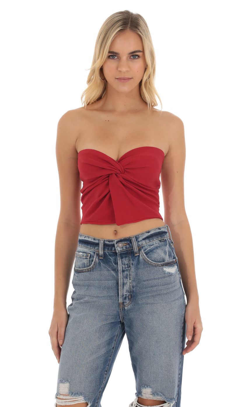 Picture Strapless Twist Top in Red. Source: https://media-img.lucyinthesky.com/data/Oct23/850xAUTO/927126d4-462f-4b93-afdc-5cdf193c5b6b.jpg