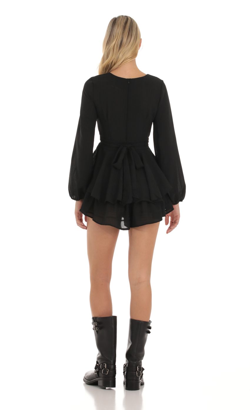 Picture Long Sleeve Wrap Romper in Black. Source: https://media-img.lucyinthesky.com/data/Oct23/850xAUTO/b0c6095b-3566-4748-8e20-fa749442ad2d.jpg