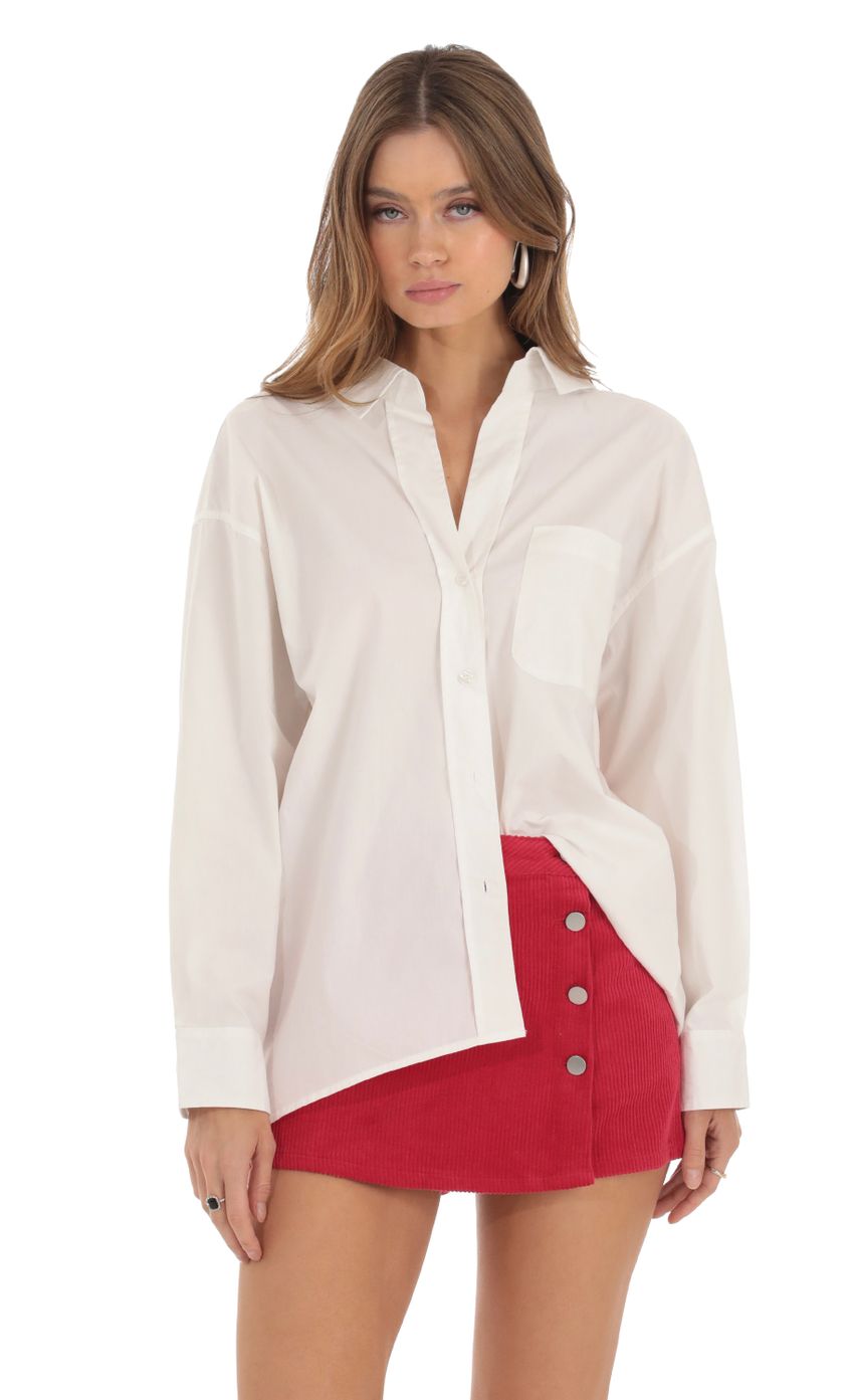 Picture Button Down Top in White. Source: https://media-img.lucyinthesky.com/data/Oct23/850xAUTO/c2745f08-3ae6-448f-a0e4-d54a33a83e06.jpg