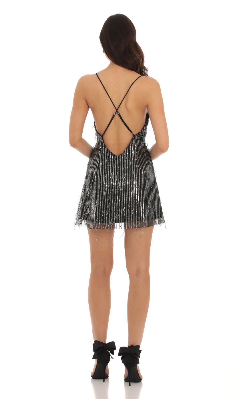Picture Fringe Sequin Deep V-Neck Dress in Black. Source: https://media-img.lucyinthesky.com/data/Oct23/850xAUTO/c3718649-d6d0-4875-8527-7a12bdcf3efb.jpg