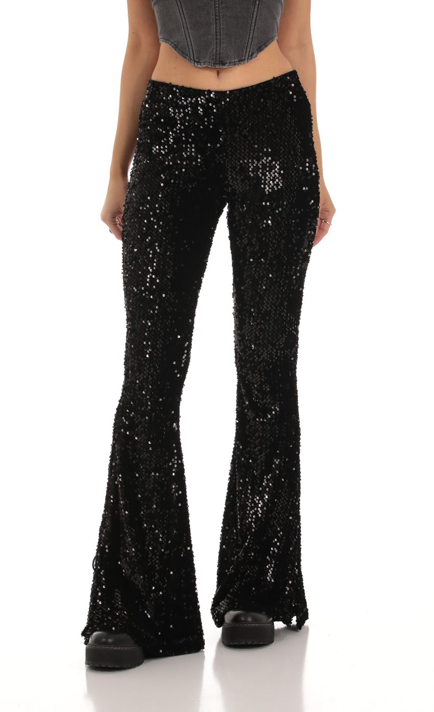 Picture Velvet Sequin Pants in Black. Source: https://media-img.lucyinthesky.com/data/Oct23/850xAUTO/d62fc742-d4f8-40a6-bf31-829e86394b28.jpg