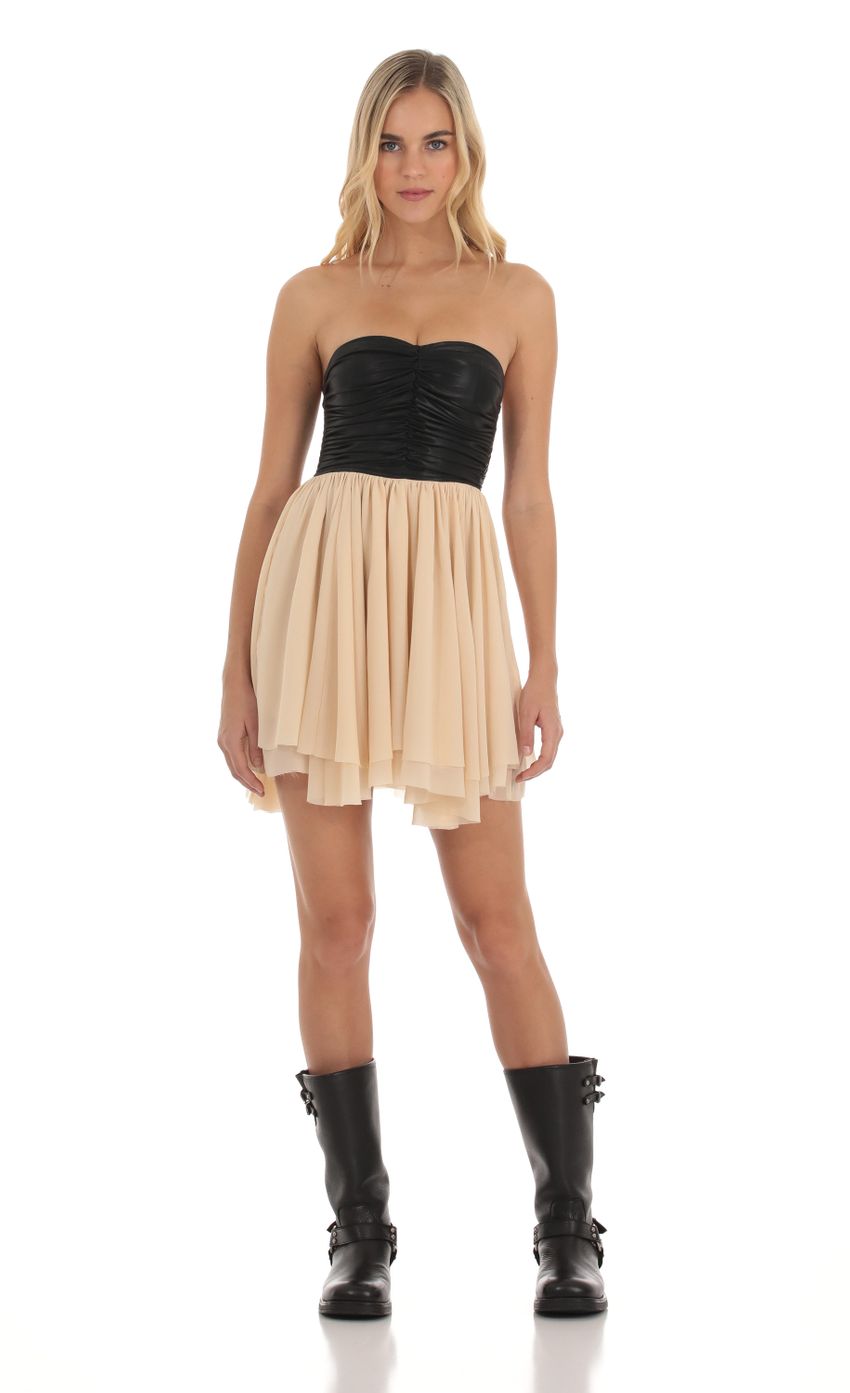 Picture Faux Leather Ruched Fit and Flare Dress in Cream and Black. Source: https://media-img.lucyinthesky.com/data/Oct23/850xAUTO/efd0aa73-8910-4e1e-9a64-cb64f487e04c.jpg