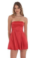 Picture Strapless Satin Fit and Flare Dress in Red. Source: https://media-img.lucyinthesky.com/data/Oct24/150xAUTO/4f5c26ad-f63b-4009-9357-e78a84e1335b.jpg