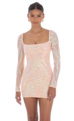 Picture Iridescent Sequin Long Sleeve Dress in Peach. Source: https://media-img.lucyinthesky.com/data/Oct24/150xAUTO/51e6037b-45dd-46db-b28d-58a3146293fa.jpg