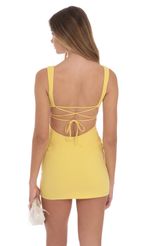 Picture Open Back Bodycon Dress in Yellow. Source: https://media-img.lucyinthesky.com/data/Oct24/150xAUTO/83e5c4e5-ae49-4908-b5eb-0e9aa831cce5.jpg