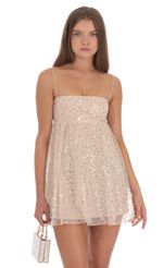 Picture Sequin Baby Doll Dress in Beige. Source: https://media-img.lucyinthesky.com/data/Oct24/150xAUTO/af02ddfa-4dde-44b8-ab7f-c4adb855da44.jpg