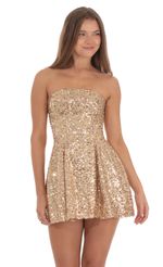 Picture Sequin Strapless Fit and Flare Dress in Gold. Source: https://media-img.lucyinthesky.com/data/Oct24/150xAUTO/b0484556-1c44-41aa-ba73-9bdd0fd3f1ab.jpg