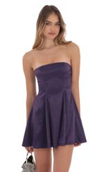 Picture Strapless Satin Fit and Flare Dress in Purple. Source: https://media-img.lucyinthesky.com/data/Oct24/150xAUTO/c16d8b61-d709-4329-a7bb-0274392ac7c7.jpg