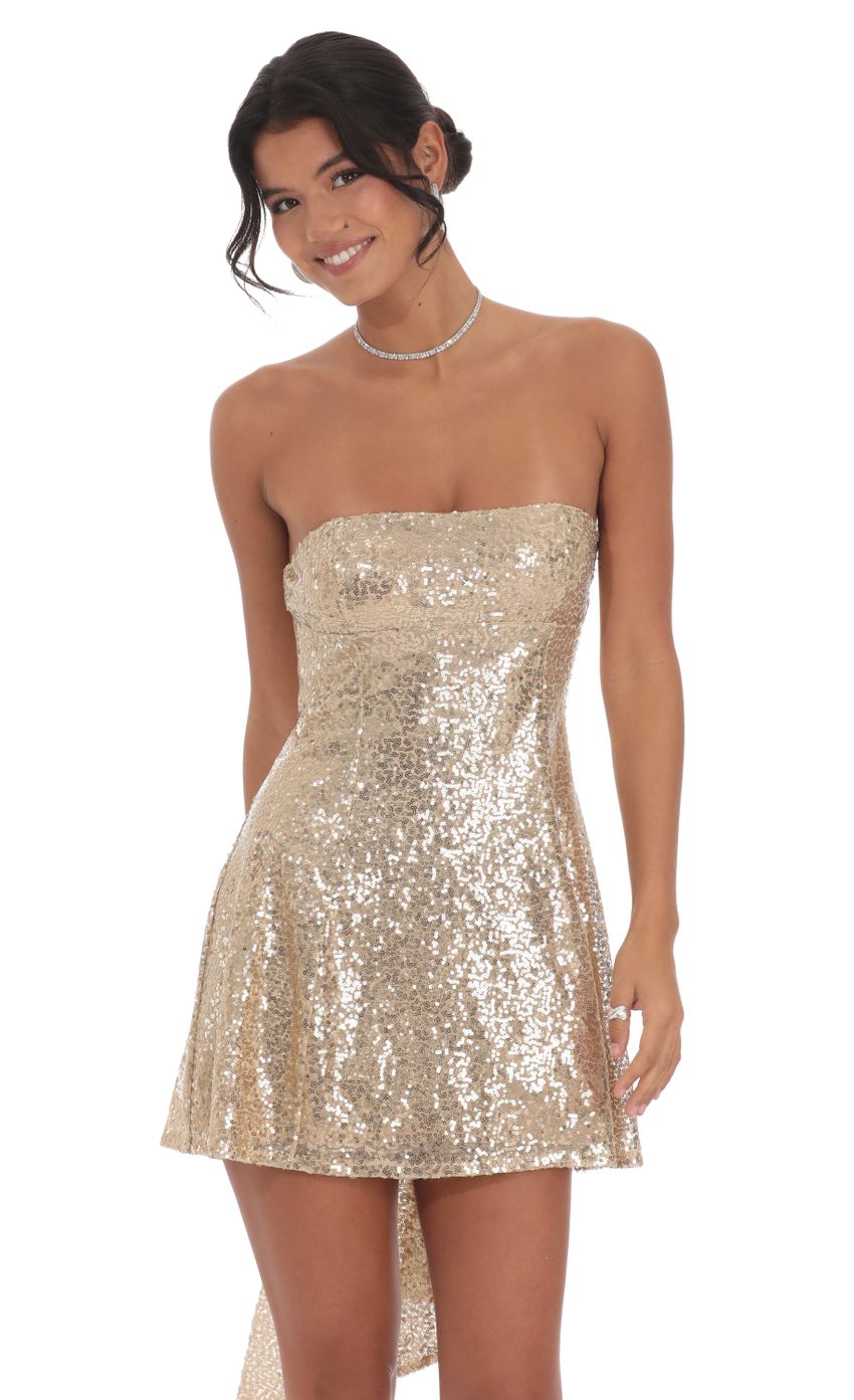 Picture Sequin Attachable Bow Dress in Gold. Source: https://media-img.lucyinthesky.com/data/Oct24/850xAUTO/081261d4-f72c-4be1-a1c8-b07c6b127bdf.jpg