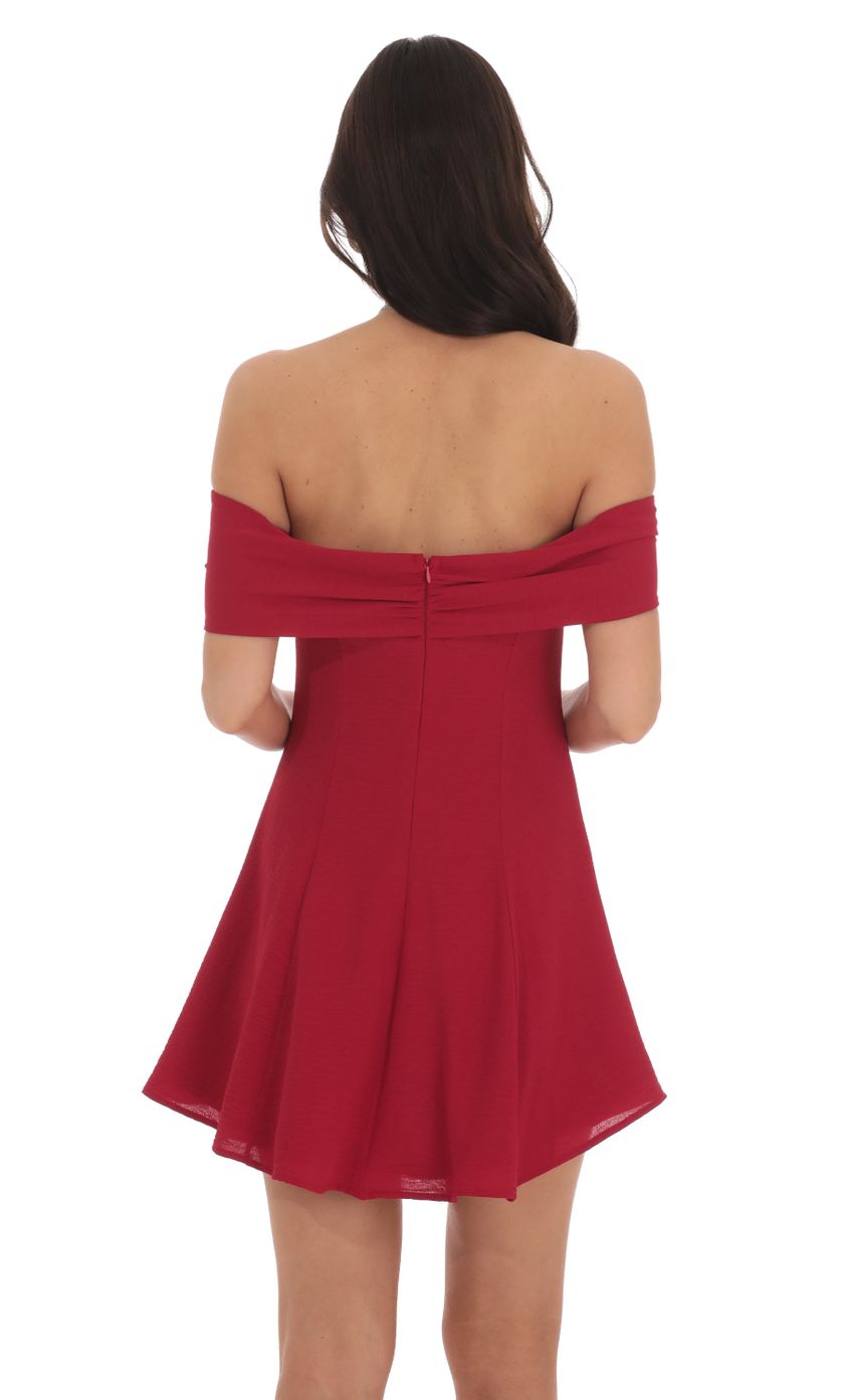 Picture Front Bow Off Shoulder Dress in Red. Source: https://media-img.lucyinthesky.com/data/Oct24/850xAUTO/22948404-a054-46e4-9cdf-a5e2664cb61d.jpg