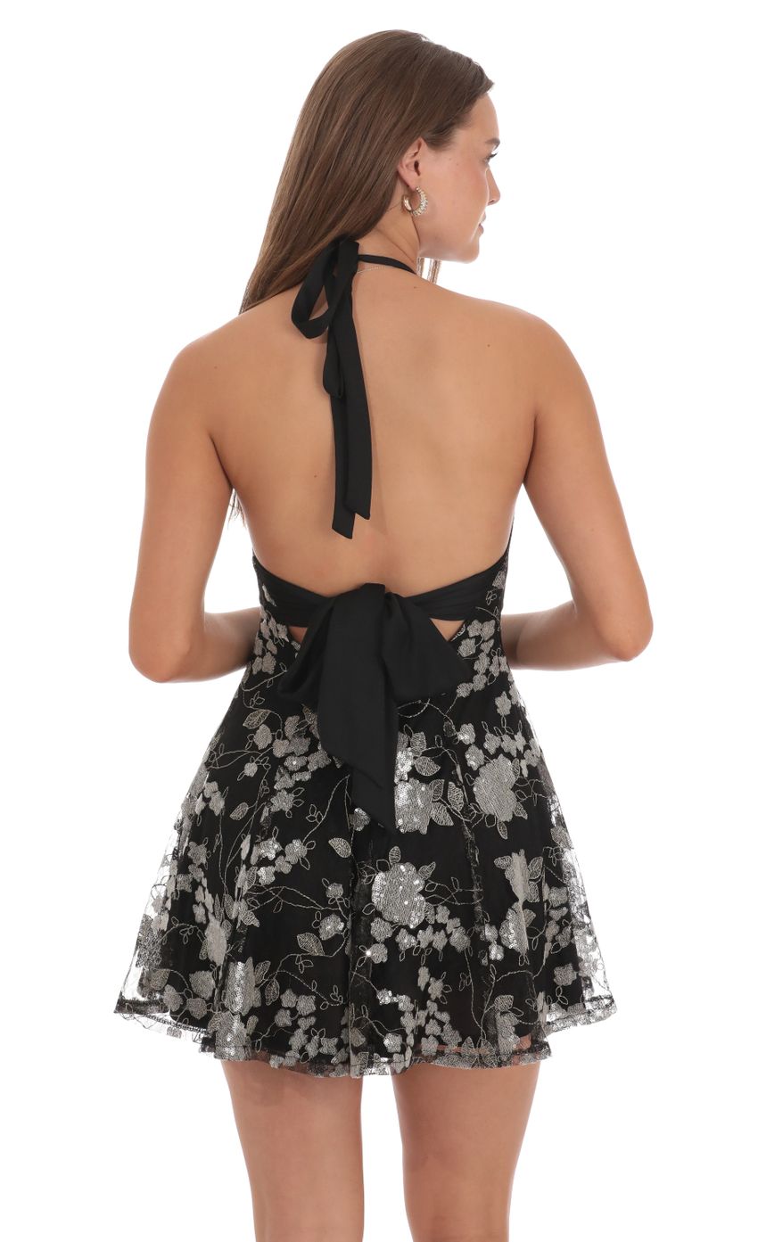 Picture Sequin Floral Embroidered Halter Open Back Dress in Black. Source: https://media-img.lucyinthesky.com/data/Oct24/850xAUTO/2b0a3638-af8d-417b-87f2-05e62632298b.jpg